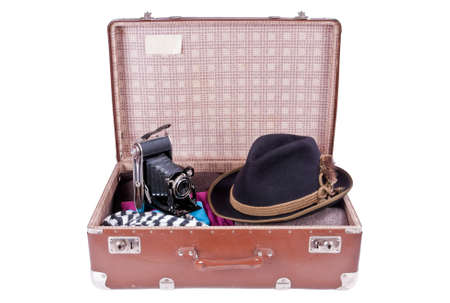Vintage photography camera with traditional Bavarian hat over whiteの写真素材