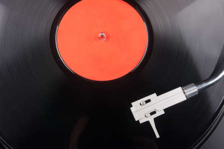 Vintage record player with vinyl record close-up