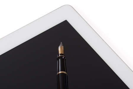 Modern tablet computer with old fountain penの写真素材