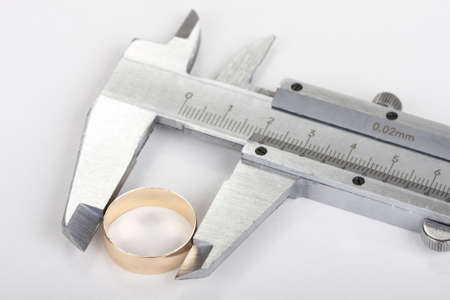 measurement of wedding rings using caliperの写真素材