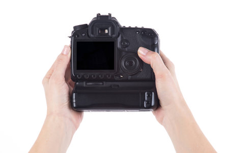 Female hands holding Digital camera over white background