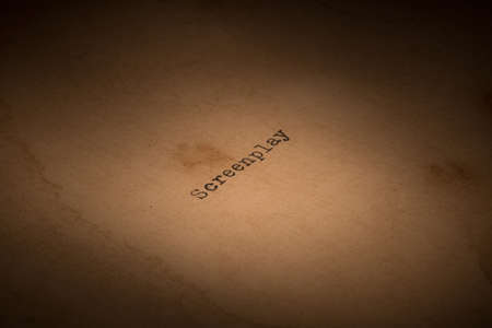 light spot on the word Screenplay on old paperの写真素材