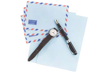 vintage air mail envelopes with a letter and fountain pen over whiteの写真素材