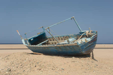 Old beached fishing Boat on the coast of Red Sea