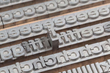 Arrangement of letterpress lead letters in row