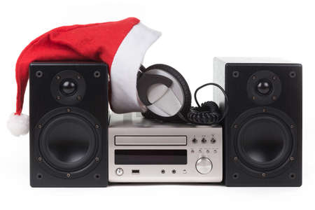 stereo with Santa Claus hat over white backgroundの写真素材