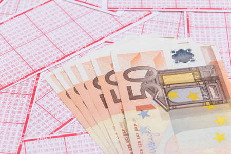 lottery ticket with 6 x 50 euro bank note