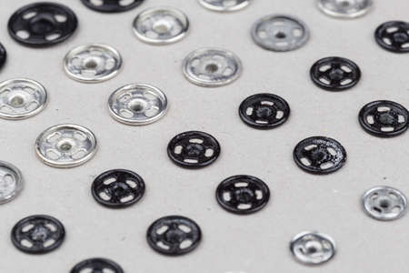 metal buttons for clothing on cardboardの写真素材