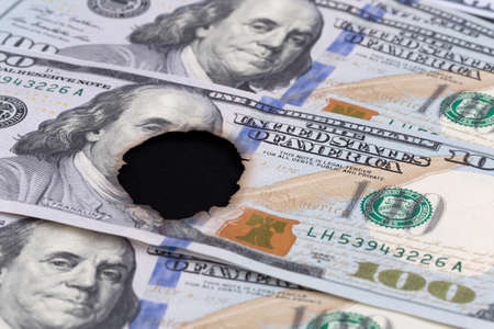 100 dollar bill burned in the middleの写真素材
