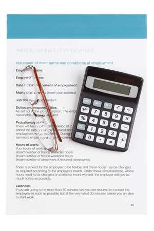 employment contract with glasses and calculator