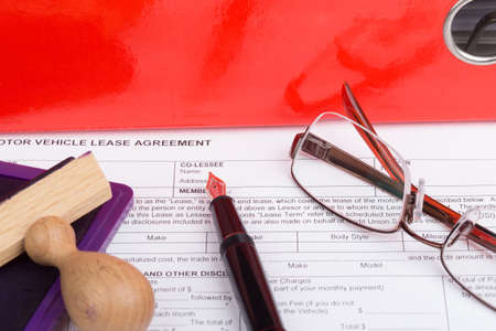 motor vehicle lease agreement with fountain pen and stampの写真素材