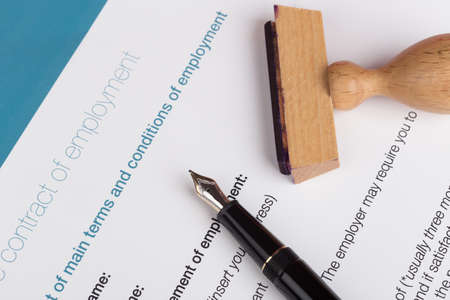 employment contract with fountain pen and stampの写真素材