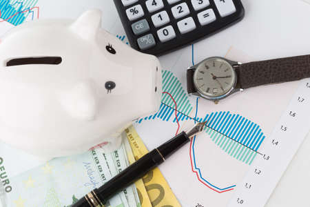 Piggybank and fountain pen with calculator