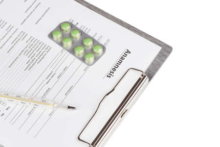 anamnesis form on the board with a Thermometer