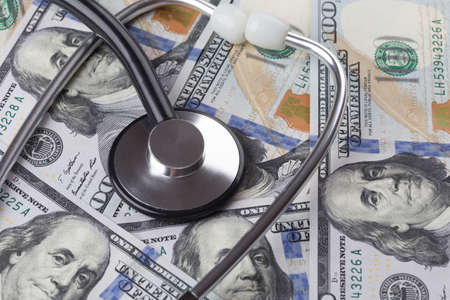 us dollar banknotes with stethoscope close-up