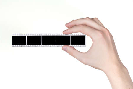 hand holds a negative over white backgroundの写真素材