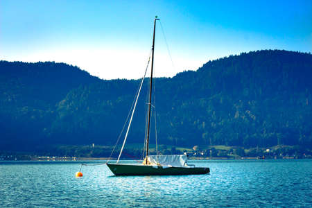 Loneley Boat in Autumn on a lake in Austriaの写真素材