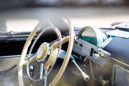 classic american car car steering wheel and dashboard
