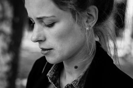 beautiful woman focused outdoorsの写真素材