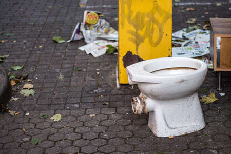 Dirty toilet bowl outdoors in the cityの写真素材