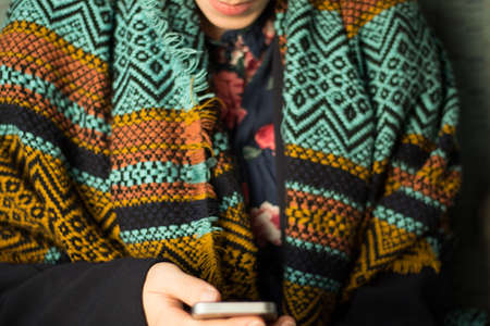 young woman working on her smartphoneの写真素材