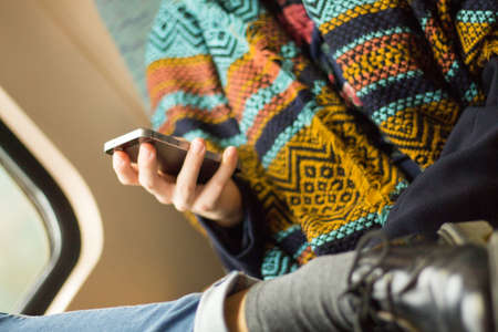 young woman working on her smartphoneの写真素材