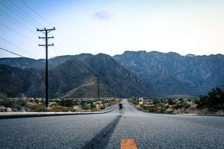 running on empty road with skid marksの写真素材