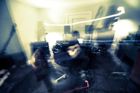 psychedelic lights around a guitar playerの写真素材