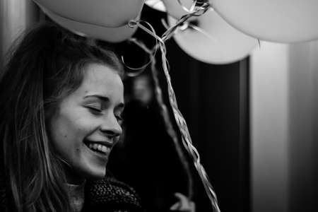 smiling girl with balloons