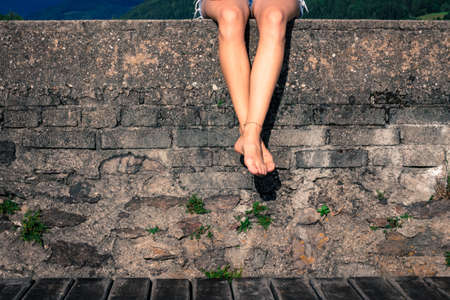 beautiful female legs from a sitting woman