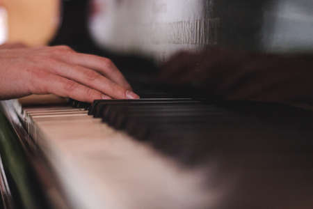 Piano Keys and Human Hand