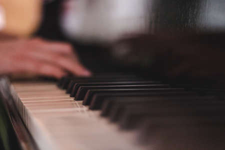 Piano Keys and Human Handの写真素材