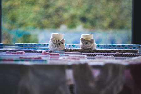 baby laundry hanging on a line-drying