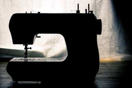 sewing machine and white curtain