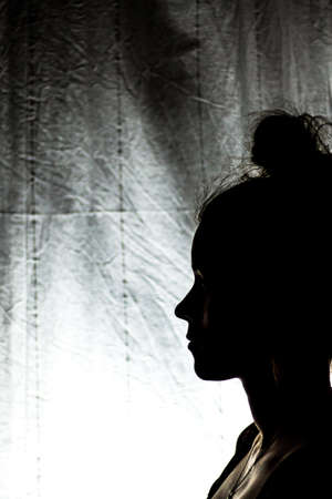 silhouette profile of an anonymous womanの写真素材