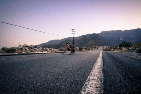 downhill skateboarding in the mountains in americaの写真素材