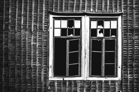 broken window of an abandoned old factory building