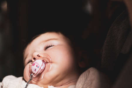 sleeping baby with pacifierの写真素材