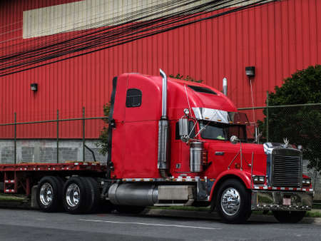 a red truck in front of a red hallの写真素材