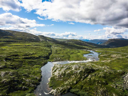 Norway river in a wide green landscapeの写真素材