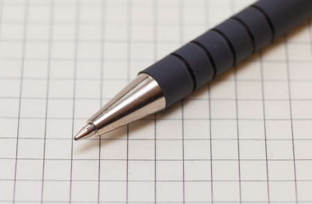Grey ballpoint pen on paperの写真素材