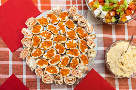 Sandwiches with red caviar on plateの写真素材