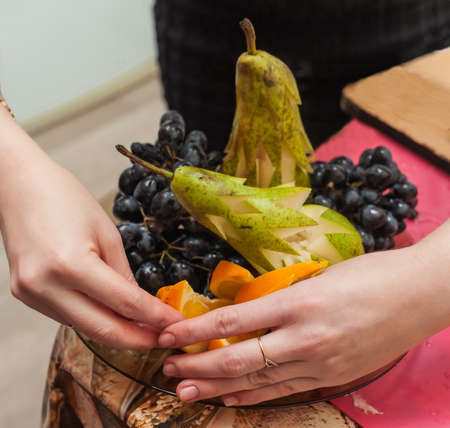 Fruit, decorated by human hands for the holiday tableの写真素材