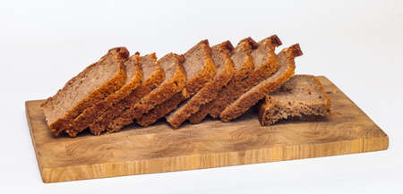 Rye homemade bread on wooden cutting Board on white background