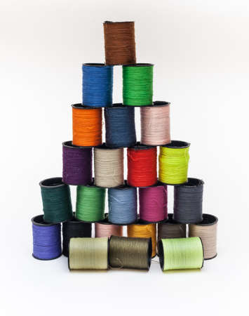 Coil set with colored thread on a white backgroundの写真素材