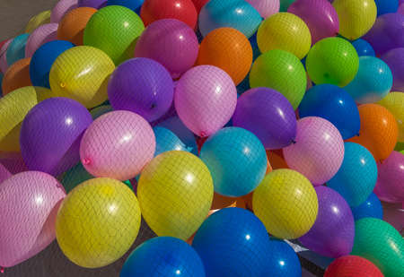 Many colored balloons under the netの写真素材