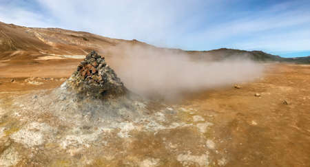 Geothermal zone Namafjall in North Iceland Valley of Geysers Hverir. High quality photo. Hot steam...