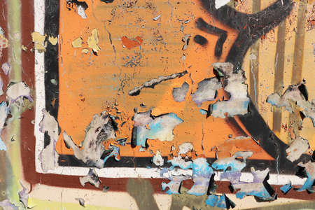 Old Weathered Graffiti Wall. Colorful Concrete Wall Fragment. Orange