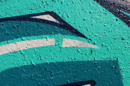 Turquoise Old Weathered Graffiti Wall. Colorful Concrete Wall Fragment.の写真素材