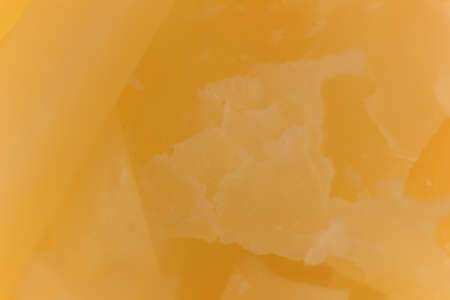 Solid Cheese macro closeup. Background Texture.の写真素材